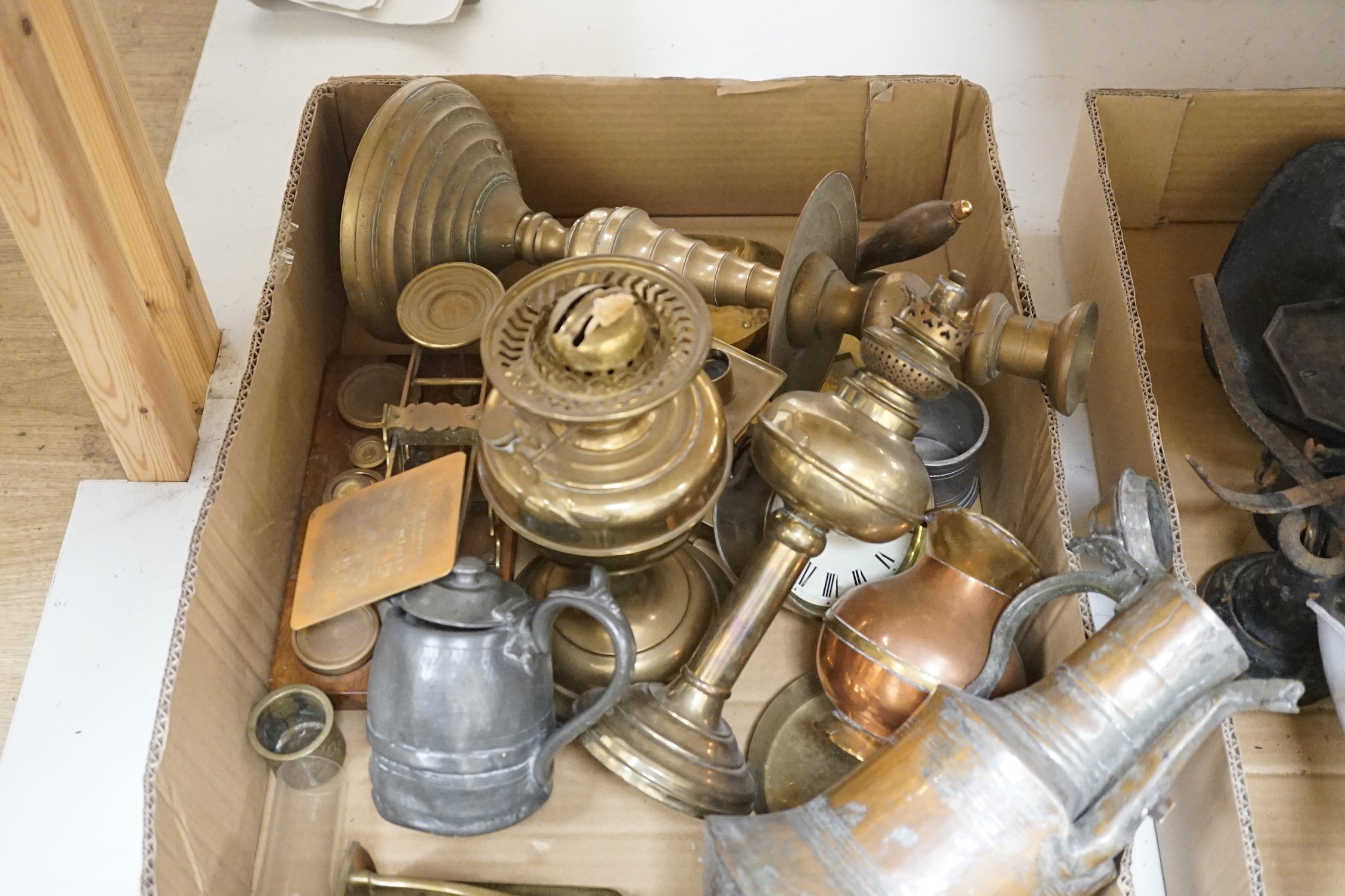 A selection of brass wares, to include an Art Nouveau style ink stand, a Parkins & Gotts postal scales, oil lamps, and other